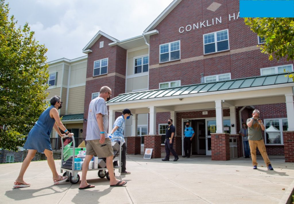 group of people walking on campus