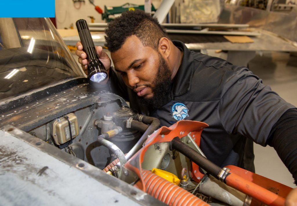 Student working on plane