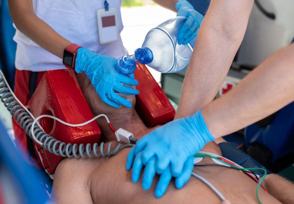 EMTs helping patient